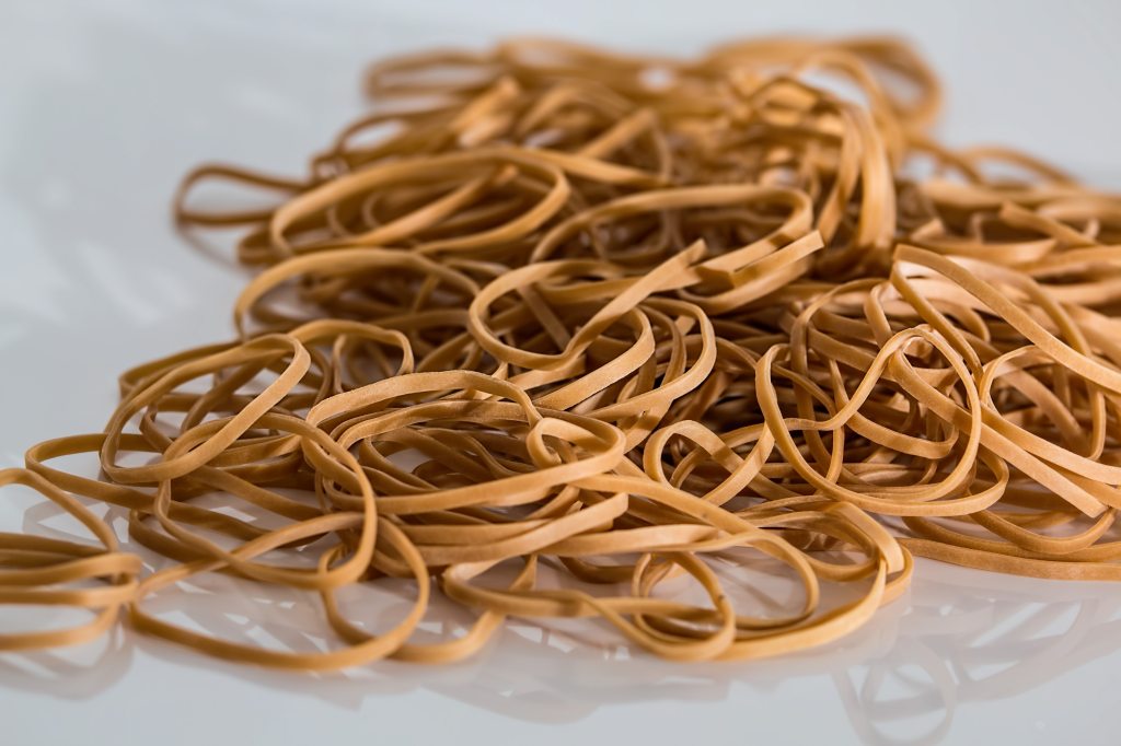 Brown Rubber Bands in a pile